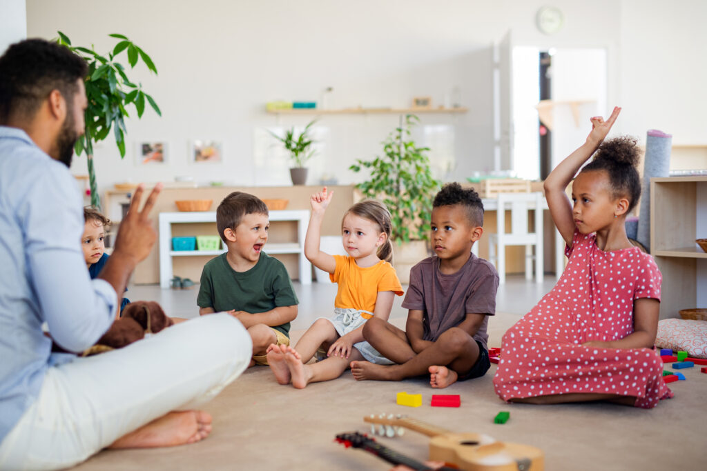 Child care provider leading a group activity with children